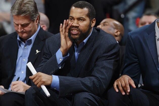 Detroit Pistons assistant coach Rasheed Wallace directs players against the Denver Nuggets in the third quarter of the Nuggets' 118-109 victory in an NBA basketball game in Denver on Wednesday, March 19, 2014. (AP Photo/David Zalubowski)