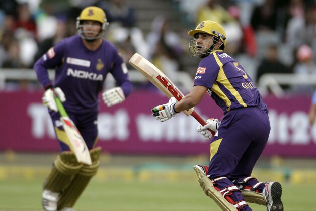 Kolkata Knight Riders Gautam Gambhir, right, makes a run against the Titans during a Champions League Twenty20  game in Cape Town, South Africa, Sunday, Oct 21, 2012. (AP Photo/Schalk van Zuydam)