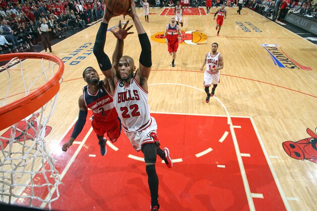 CHICAGO, IL - APRIL 29: Taj Gibson #22 of the Chicago Bulls dunks against the Washington Wizards in Game 5 of the Eastern Conference Quarterfinals in the 2014 NBA Playoffs on April 29, 2014 at the United Center in Chicago, Illinois. NOTE TO USER: User expressly acknowledges and agrees that, by downloading and/or using this photograph, user is consenting to the terms and conditions of the Getty Images License Agreement.  Mandatory Copyright Notice: Copyright 2014 NBAE (Photo by Gary Dineen/NBAE via Getty Images)