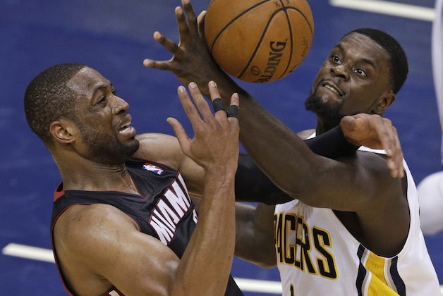 Miami Heat's Dwyane Wade is fouled by Indiana Pacers' Lance Stephenson during the second half of Game 5 of the Eastern Conference finals NBA basketball playoff series Wednesday, May 28, 2014, in Indianapolis. (AP Photo/Darron Cummings)