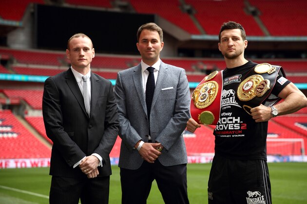 LONDON, ENGLAND - MAY 29:  Promoter Eddie Hearn stands inbetween Carl Froch and George Groves as they go head to head during a press conference to announce the upcoming WBA & IBF Super Middleweight World Championship fight between Carl Froch and George Groves at Wembley Stadium on May 29, 2014 in London, England.  (Photo by Jordan Mansfield/Getty Images)