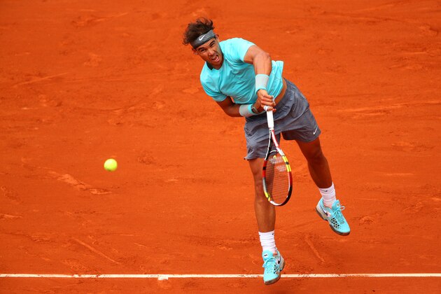 PARIS, FRANCE - MAY 29:  Rafael Nadal of Spain serves during his men's singles match against dominic thiem of Austria on day five of the French Open at Roland Garros on May 29, 2014 in Paris, France.  (Photo by Clive Brunskill/Getty Images)