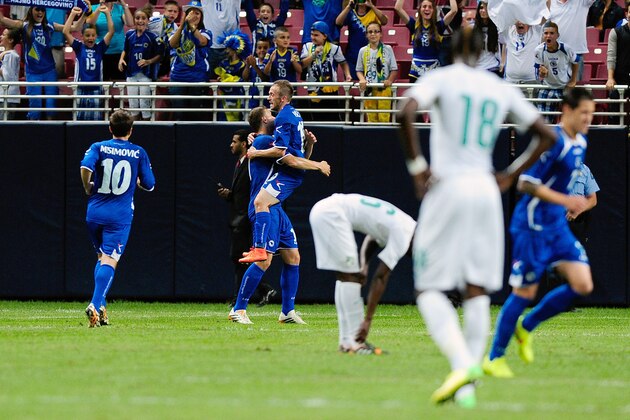 ST. LOUIS, MO - MAY 30: Edin Dzeko #11 and Edin Visca #19 of Bosnia-Herzegovina celebrate a goal against the Ivory Coast during the first half at Edward Jones Dome on May 30, 2014 in St. Louis, Missouri.  (Photo by Jeff Curry/Getty Images)