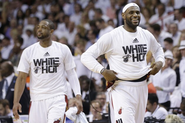 Miami Heat forward LeBron James, right, and guard Dwyane Wade smile during the second half Game 6 in the NBA basketball playoffs Eastern Conference finals against the Indiana Pacers, Friday, May 30, 2014, in Miami. The Miami Heat defeated the Indiana Pacers 117-92 to advance to the NBA Finals. (AP Photo/Lynne Sladky)