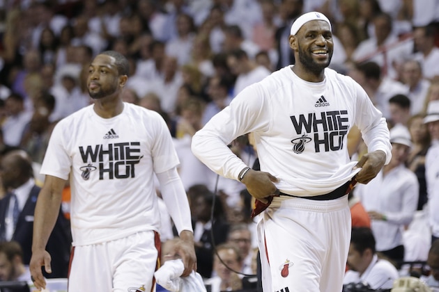 Miami Heat forward LeBron James, right, and guard Dwyane Wade smile during the second half Game 6 in the NBA basketball playoffs Eastern Conference finals against the Indiana Pacers, Friday, May 30, 2014, in Miami. The Miami Heat defeated the Indiana Pacers 117-92 to advance to the NBA Finals. (AP Photo/Lynne Sladky)
