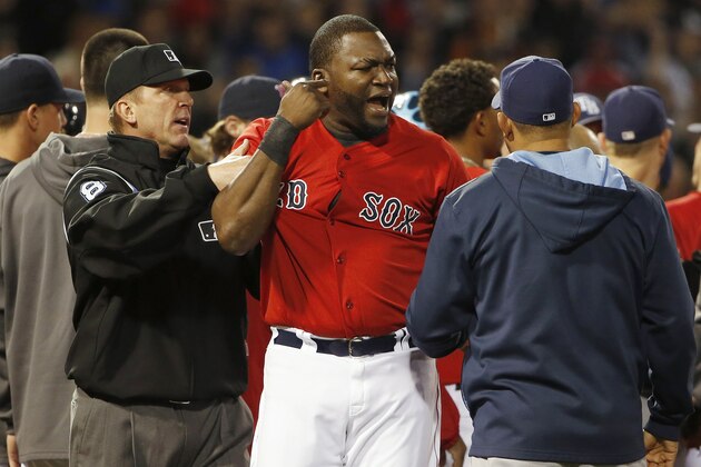 BOSTON, MA - MAY 30:  David Ortiz #34 of the Boston Red Sox is contained by an unidentified Tampa Bay Ray and umpire Jeff Kellogg #8 after teammate Mike Carp #37 of the Boston Red Sox was hit by a pitch during the fourth inning of the game at Fenway Park on May 30, 2014 in Boston, Massachusetts.  (Photo by Winslow Townson/Getty Images)