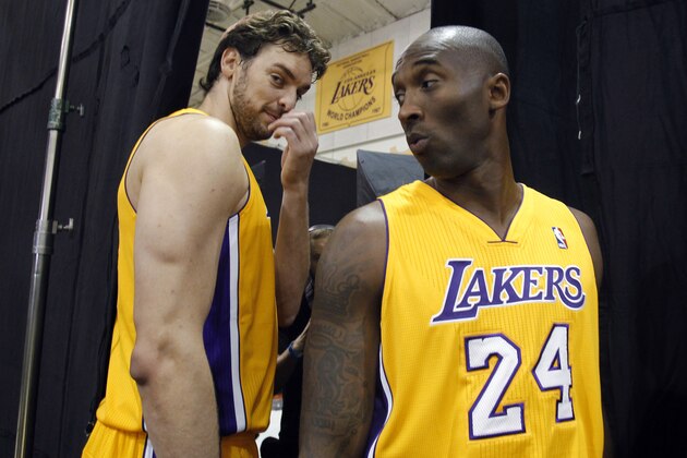 Los Angeles Lakers forward Pau Gasol, left, of Spain, stands with guard Kobe Bryant, right, during the NBA basketball team's media day Saturday, Sept. 28, 2013, in El Segundo, Calif. (AP Photo/Alex Gallardo)