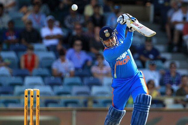PERTH, AUSTRALIA - FEBRUARY 08:  Virender Sehwag of India drives for four during the One Day International match between India and Sri Lanka at WACA on February 8, 2012 in Perth, Australia.  (Photo by Hamish Blair/Getty Images)