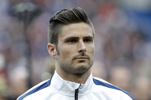 Olivier Giroud of France poses before the friendly soccer match between France and Norway at the Stade de France stadium in Saint Denis, outside Paris, Tuesday, May 27, 2014. France are preparing for the upcoming soccer World Cup in Brazil starting on 12 June. (AP Photo/Christophe Ena)