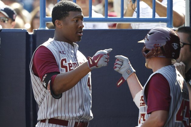 Feb 25, 2014; Tampa, FL, USA;  Florida State Seminoles pitcher/outfielder Jameis Winston (44) come back into the dugout after he batted during the sixth inning against the New York Yankees at George M. Steinbrenner Field. Mandatory Credit: Kim Klement-USA TODAY Sports