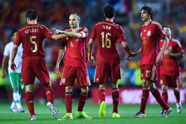 SEVILLE, SPAIN - MAY 30:  Andres Iniesta (2ndL) of Spain celebrates wit his teammates after scoring his team's second goal during an international friendly match between Spain and Bolivia at Estadio Ramon Sanchez Pizjuan on May 30, 2014 in Seville, Spain.  (Photo by David Ramos/Getty Images)