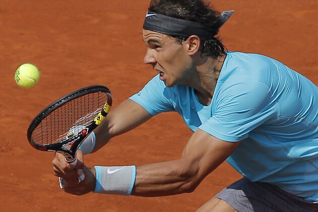 Spain's Rafael Nadal returns the ball to Argentina's Leonardo Mayer during their third round match of  the French Open tennis tournament at the Roland Garros stadium, in Paris, France, Saturday, May 31, 2014. (AP Photo/Michel Spingler)