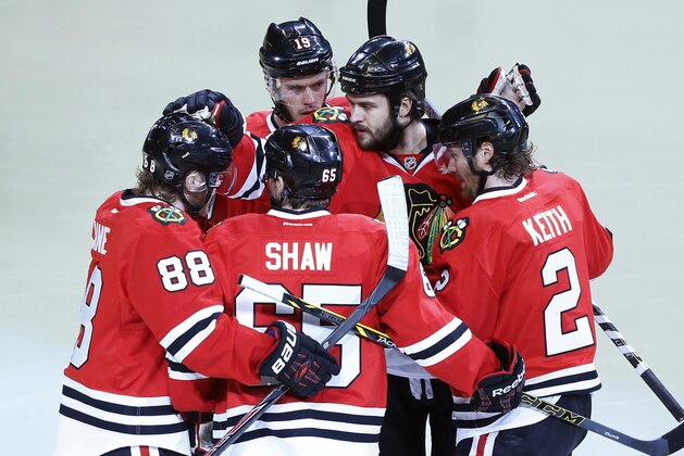 Chicago Blackhawks defenseman Brent Seabrook, second from right, celebrates a goal with his teammates during the first period in Game 5 of the Western Conference finals against the Los Angeles Kings in the NHL hockey Stanley Cup playoffs Wednesday, May 28, 2014, in Chicago. (AP Photo/Andrew A. Nelles)