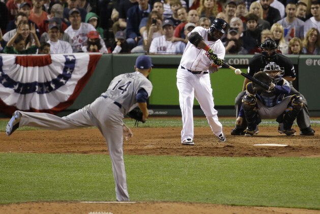 Boston Red Sox's David Ortiz hits his second home run of the game off Tampa Bay Rays starting pitcher David Price (14), in front of Rays catcher Jose Molina, right, in the eighth inning in Game 2 of baseball's American League division series Saturday, Oct. 5, 2013, in Boston. (AP Photo/Stephan Savoia)