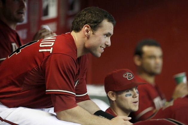 Arizona Diamondbacks' Paul Goldschmidt sits with teammates in the dugout prior to a baseball game against the Washington Nationals on Wednesday, May 14, 2014, in Phoenix. (AP Photo)