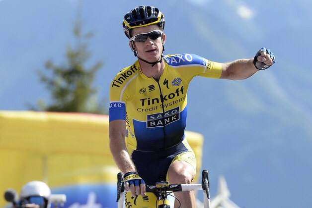 Australia's Micheal Rogers celebrates as he wins the 20th stage of the Giro d'Italia, Tour of Italy cycling race, from Maniago to Monte Zoncolan, Italy, Saturday, May 31, 2014. Nairo Quintana virtually clinched the Giro d'Italia title Saturday with a strong ride up the demanding Monte Zoncolan, while Michael Rogers benefited from a fan interruption to post his second stage victory of the race. (AP Photo/Fabio Ferrari)