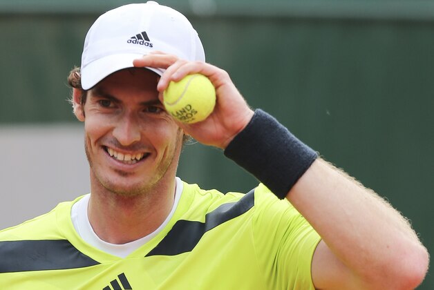 Britain's Andy Murray adjusts his cap as he plays Kazakhstan's Andrey Golubev during the first round match of  the French Open tennis tournament at the Roland Garros stadium, in Paris, France, Tuesday, May 27, 2014. Murray won 6-1, 6-4, 3-6, 6-3. (AP Photo/David Vincent)