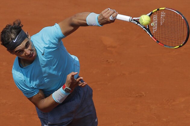 Spain's Rafael Nadal serves the ball to Argentina's Leonardo Mayer during their third round match of  the French Open tennis tournament at the Roland Garros stadium, in Paris, France, Saturday, May 31, 2014. (AP Photo/Michel Spingler)