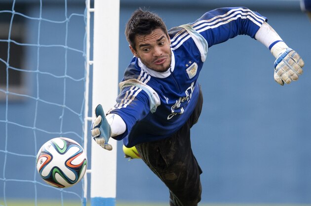 Argentina's national soccer goalkeeper Sergio Romero catches the ball during a training session in Buenos Aires, Argentina, Saturday, May 31, 2014. Argentina is training for the Brazil 2014 World Cup.(AP Photo/Natacha Pisarenko)