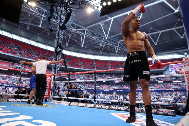 LONDON, ENGLAND - MAY 31:  Anthony Joshua finishes Matt Legg in the 1st round during their Heavyweight bout at Wembley Stadium on May 31, 2014 in London, England.  (Photo by Scott Heavey/Getty Images)