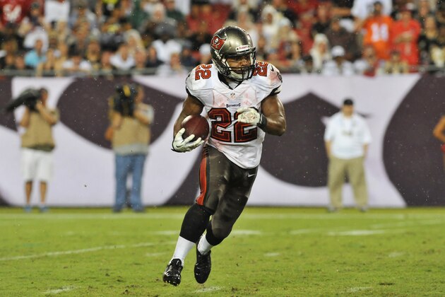 TAMPA, FL - SEPTEMBER 15:  Running back Doug Martin #22 of the Tampa Bay Buccaneers rushes upfield in the 4th quarter against the New Orleans Saints September 15, 2013 at Raymond James Stadium in Tampa, Florida. The Saints won 16  - 14.  (Photo by Al Messerschmidt/Getty Images)