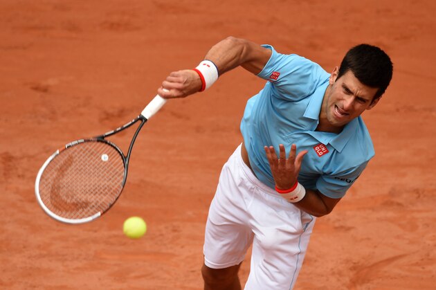 PARIS, FRANCE - MAY 30:  Novak Djokovic of Serbia serves during his men's singles match against Marin Cilic of Croatia on day six of the French Open at Roland Garros on May 30, 2014 in Paris, France.  (Photo by Matthias Hangst/Getty Images)