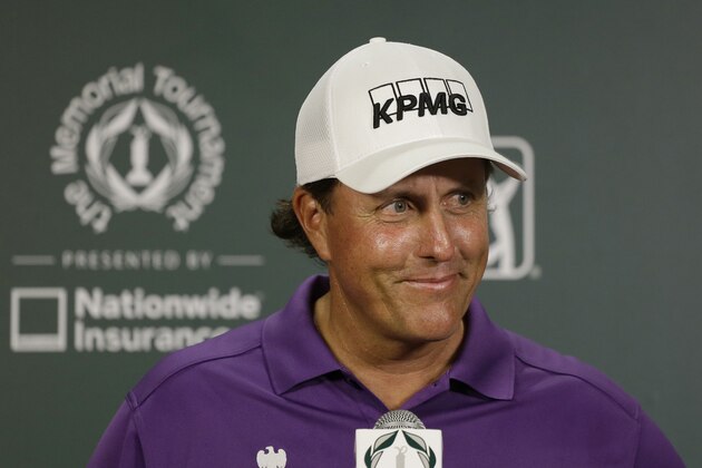 Phil Mickelson listens to a question during a news conference following the third round of the Memorial golf tournament Saturday, May 31, 2014, in Dublin, Ohio. (AP Photo/Darron Cummings)