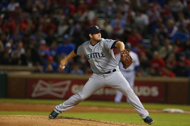 ARLINGTON, TX - APRIL 15:  Dominic Leone #52 of the Seattle Mariners throws against the Texas Rangers in the 5th inning at Globe Life Park in Arlington on April 15, 2014 in Arlington, Texas.  (Photo by Ronald Martinez/Getty Images)