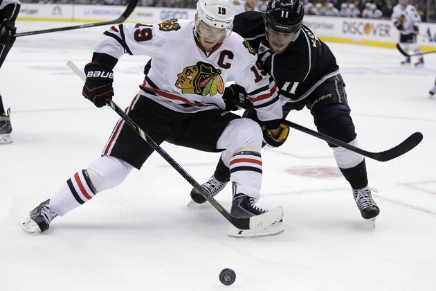 Chicago Blackhawks center Jonathan Toews, left, battles Los Angeles Kings center Anze Kopitar for the puck during first period of Game 6 of the Western Conference finals of the NHL hockey Stanley Cup playoffs in Los Angeles. Friday, May 30, 2014. (AP Photo/Chris Carlson)