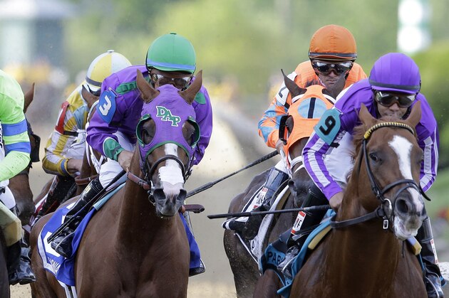FILE - In this Saturday, May 17, 2014 file photo, California Chrome, center, ridden by Victor Espinoza, Pablo Del Monte, right, ridden by Jeffrey Sanchez, and Ria Antonia, left, ridden by Calvin Borel, race to the first turn during the 139th Preakness Stakes horse race at Pimlico Race Coursein Baltimore. California Chrome might abandon his Triple Crown bid if New York officials do not allow the colt to wear a nasal strip in the Belmont Stakes. (AP Photo/Patrick Semansky), File