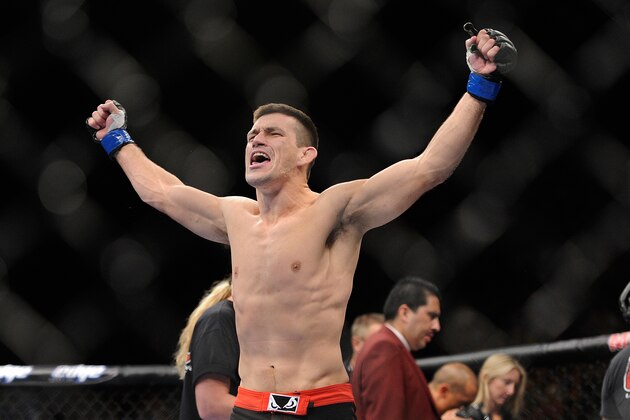 Demian Maia celebrates after knocking down Dong Hyun Kim during the first round their UFC 148 welterweight fight at the MGM Grand Garden Arena, Saturday, July 7, 2012, in Las Vegas. Maia won the bout by TKO. (AP Photo/David Becker)