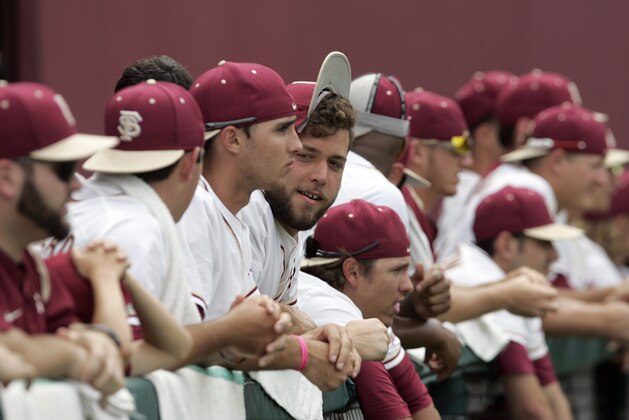 Florida State's players don their rally caps as they managed to score five runs against Alabama in the bottom of the ninth inning of an NCAA regional college baseball game on Saturday,  May 31, 2014, in Tallahassee, Fla. Alabama won the game 6-5 to advance in the regional tournament.  (AP Photo/Steve Cannon)
