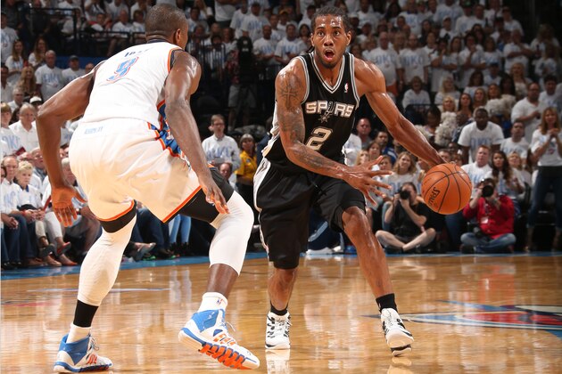 OKLAHOMA CITY, OK  MAY 31: Kawhi Leonard #2 of the San Antonio Spurs handles the ball against the Oklahoma City Thunder in Game Six of the Western Conference Finals during the 2014 NBA Playoffs on May 31, 2014 at the Chesapeake Energy Arena in Oklahoma City, Oklahoma.  NOTE TO USER: User expressly acknowledges and agrees that, by downloading and or using this photograph, User is consenting to the terms and conditions of the Getty Images License Agreement. Mandatory Copyright Notice: Copyright 2014 NBAE  (Photo by Layne Murdoch Jr./NBAE via Getty Images)