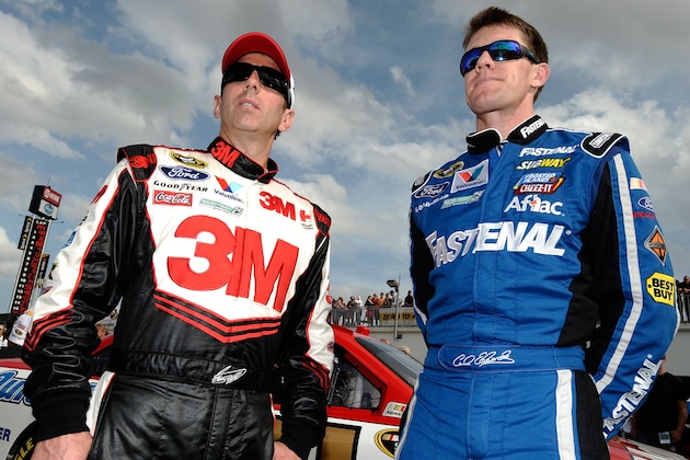 DAYTONA BEACH, FL - FEBRUARY 19:  (L-R) Greg Biffle, driver of the #16 3M Ford, and Carl Edwards, driver of the #99 Fastenal Ford, stand in the garage after qualifying for the NASCAR Sprint Cup Series Daytona 500 at Daytona International Speedway on February 19, 2012 in Daytona Beach, Florida. Edwards is in the pole position.  (Photo by Jared C. Tilton/Getty Images for NASCAR)