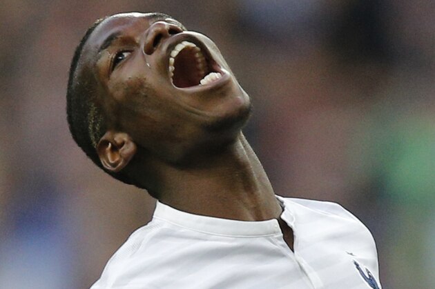 Paul Pogba of France reacts after missing a goal during the friendly soccer match between France and Norway at the Stade de France stadium in Saint Denis, outside Paris, Tuesday, May 27, 2014. France are preparing for the upcoming soccer World Cup in Brazil starting on 12 June. (AP Photo/Christophe Ena)