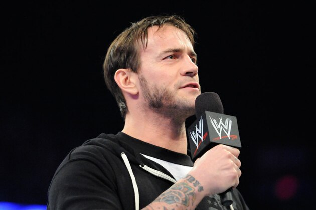 CHICAGO, IL - MAY 4: Professional wrestler CM Punk addresses the crowd before taking his shot in between periods of Game Two of the Second Round of the 2014 Stanley Cup Playoffs between the Minnesota Wild and the Chicago Blackhawks at the United Center on May 04, 2014 in Chicago, Illinois. (Photo by Bill Smith/NHLI via Getty Images)