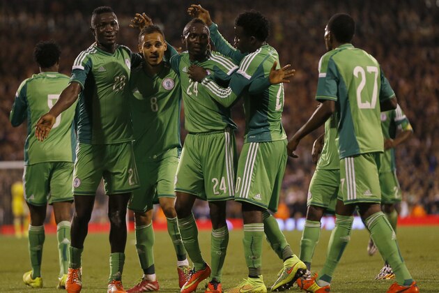 Nigeria's Uche Nwofor, centre, celebrates with team mates after he scores a goal during the international friendly soccer match between Nigeria and Scotland at Craven Cottage Stadium in London, Wednesday, May 28, 2014. (AP Photo/Kirsty Wigglesworth)