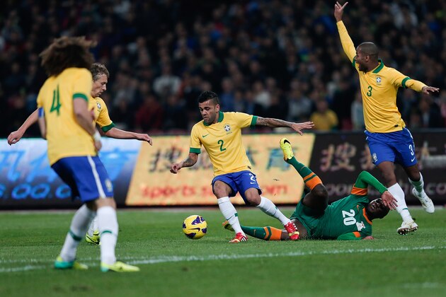 BEIJING, CHINA - OCTOBER 15:  Silva Daniel (#2) and Silva Anderson (#3) of Brazil (Center) competes the ball with Mayuka Emmanuel (Center) of Zambia during the international friendly match between Brazil and Zambia at Beijing National Stadium on October 15, 2013 in Beijing, China.  (Photo by Lintao Zhang/Getty Images)