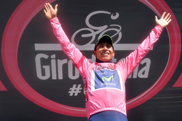 Colombia's Nairo Quintana celebrates on the podium after completing the 20th stage of the Giro d'Italia, Tour of Italy cycling race, from Maniago to Monte Zoncolan, Italy, Saturday, May 31, 2014. Nairo Quintana virtually clinched the Giro d'Italia title Saturday with a strong ride up the demanding Monte Zoncolan, while Michael Rogers benefited from a fan interruption to post his second stage victory of the race. (AP Photo/Gian Mattia D'Alberto)