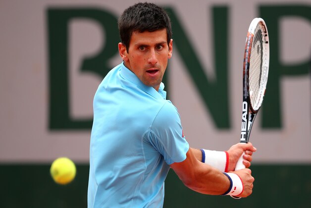 PARIS, FRANCE - MAY 30:  Novak Djokovic of Serbia returns a shot during his men's singles match against Marin Cilic of Croatia on day six of the French Open at Roland Garros on May 30, 2014 in Paris, France.  (Photo by Clive Brunskill/Getty Images)