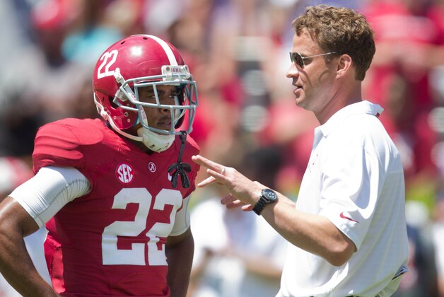 Apr 19, 2014; Tuscaloosa, AL, USA;  Alabama Crimson Tide offensive coordinator/quarterbacks coach Lane Kiffin talks to wide receiver Christion Jones (22) prior to the A-Day game at Bryant-Denny Stadium. Mandatory Credit: Marvin Gentry-USA TODAY Sports