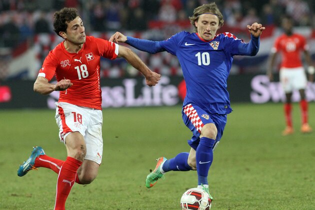 ST GALLEN, SWITZERLAND - MARCH 05: Luka Modric of Croatia (R) challenges Admir Mehmedi of Switzerland (L) during the international friendly match between Switzerland and Croatia at the AFG Arena on March 5, 2014 in St Gallen, Switzerland.  (Photo by Marc Eich/Getty Images)