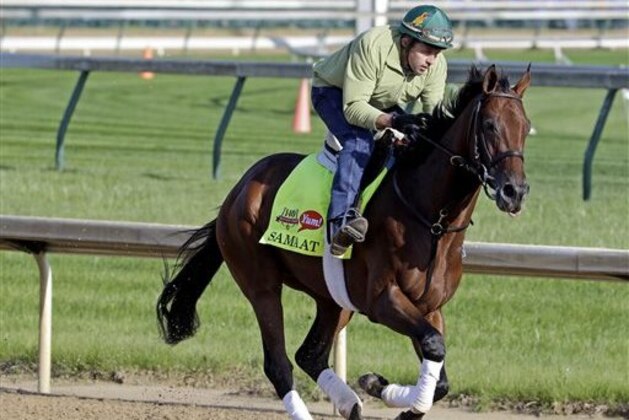 ADVANCE FOR WEEKEND EDITIONS, JUNE 1-2 - FILE - In this May 1, 2014 file photo, exercise rider Simon Paine takes Kentucky Derby entrant Samraat for a morning workout at Churchill Downs in Louisville, Ky. California Chrome's bid to become racing's first Triple Crown winner in 36 years isn't scaring away the competition. Horses are lining up to challenge the Kentucky Derby and Preakness winner in the Belmont Stakes next weekend.  (AP Photo/Morry Gash, File)