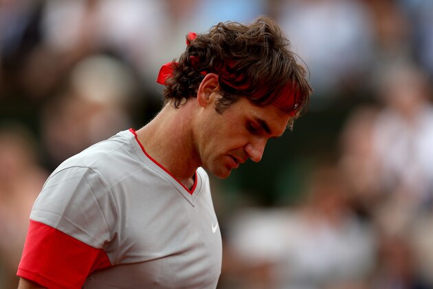 PARIS, FRANCE - JUNE 01:  Roger Federer of Switzerland reacts during his men's singles match against Ernests Gulbis of Latvia on day eight of the French Open at Roland Garros on June 1, 2014 in Paris, France.  (Photo by Matthew Stockman/Getty Images)