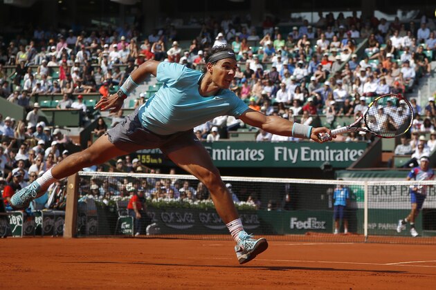 Spain's Rafael Nadal returns the ball during the third round match of the French Open tennis tournament against Argentina's Leonardo Mayer at the Roland Garros stadium, in Paris, France, Saturday, May 31, 2014. (AP Photo/Michel Euler)