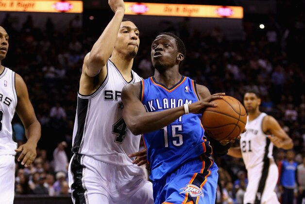 SAN ANTONIO, TX - MAY 29: Reggie Jackson #15 of the Oklahoma City Thunder drives to the basket against Danny Green #4 of the San Antonio Spurs in the third quarter during Game Five of the Western Conference Finals of the 2014 NBA Playoffs at AT&T Center on May 29, 2014 in San Antonio, Texas. NOTE TO USER: User expressly acknowledges and agrees that, by downloading and or using this photograph, User is consenting to the terms and conditions of the Getty Images License Agreement.  (Photo by Ronald Martinez/Getty Images)