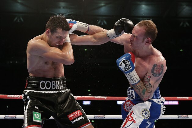 LONDON, ENGLAND - MAY 31:  George Groves in action with Carl Froch in their IBF and WBA World Super Middleweight bout at Wembley Stadium on May 31, 2014 in London, England.  (Photo by Scott Heavey/Getty Images)