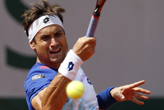 Spain's David Ferrer returns the ball to Italy's Andreas Seppi during the third round match of  the French Open tennis tournament at the Roland Garros stadium, in Paris, France, Saturday, May 31, 2014. (AP Photo/Darko Vojinovic)