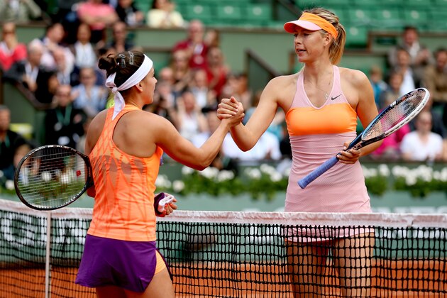 PARIS, FRANCE - MAY 30:  Maria Sharapova of Russia shakes hands at the net with Paula Ormaechea of Argentina after their women's singles match on day six of the French Open at Roland Garros on May 30, 2014 in Paris, France.  (Photo by Matthew Stockman/Getty Images)