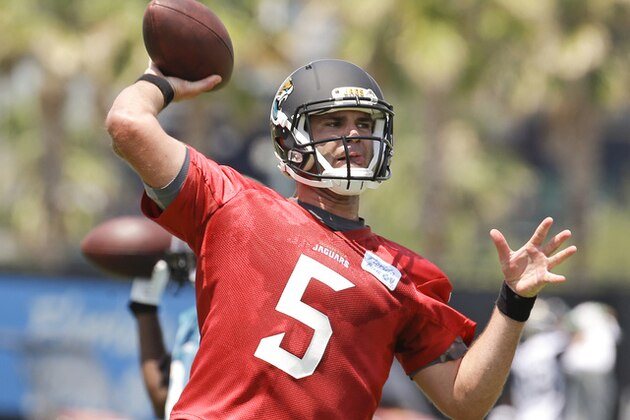 Jacksonville Jaguars quarterback Blake Bortles (5) throws a pass during an NFL organized team activities football practice in Jacksonville, Fla., Wednesday, May 28, 2014. (AP Photo/John Raoux)